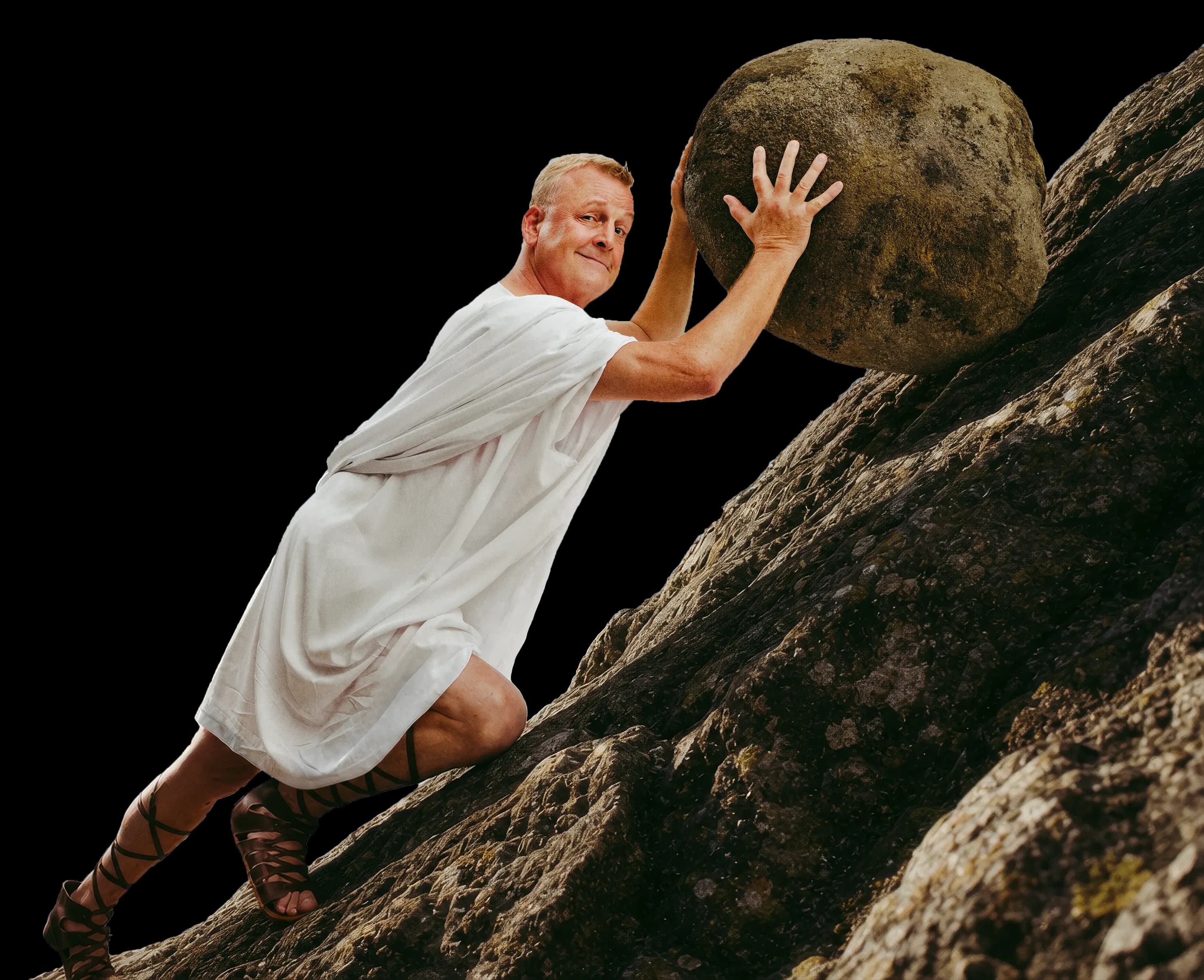 Jan Gintberg skubber en kæmpe sten op ad bjerget